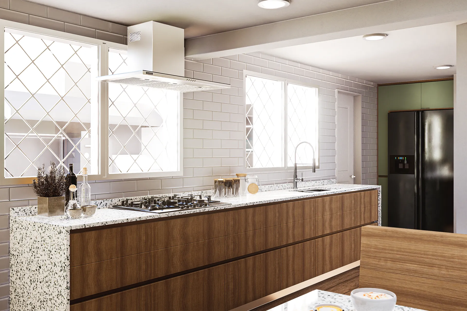 Cocina con isla de granito, campana blanca y muebles de madera, Casa Monseñor Eyzaguirre
